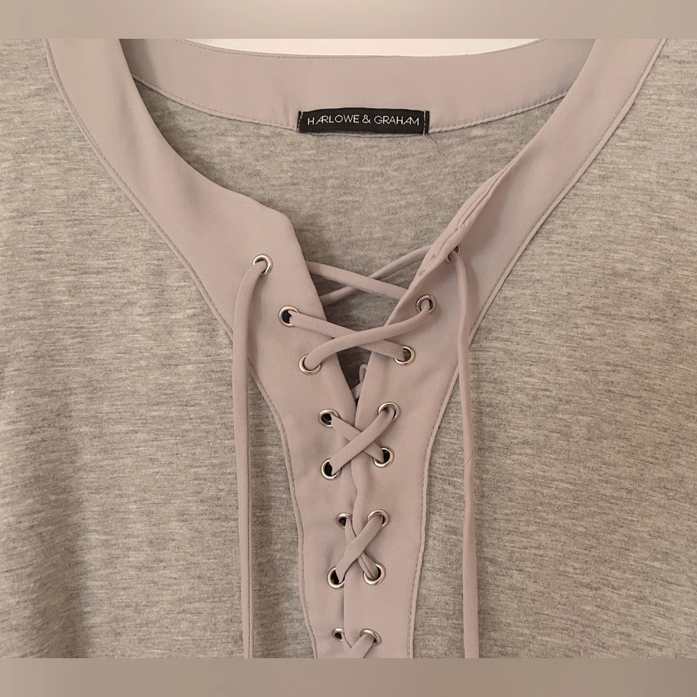Long sleeve, lace front. Lightweight gray top.